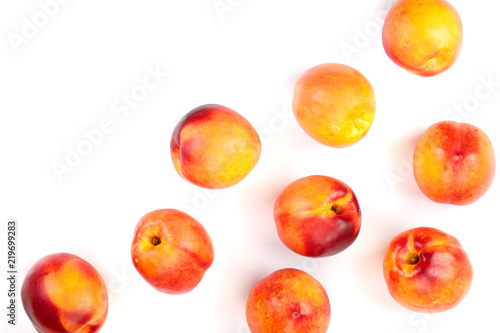 ripe nectarine with leaves isolated on white background with copy space for your text. Top view. Flat lay pattern