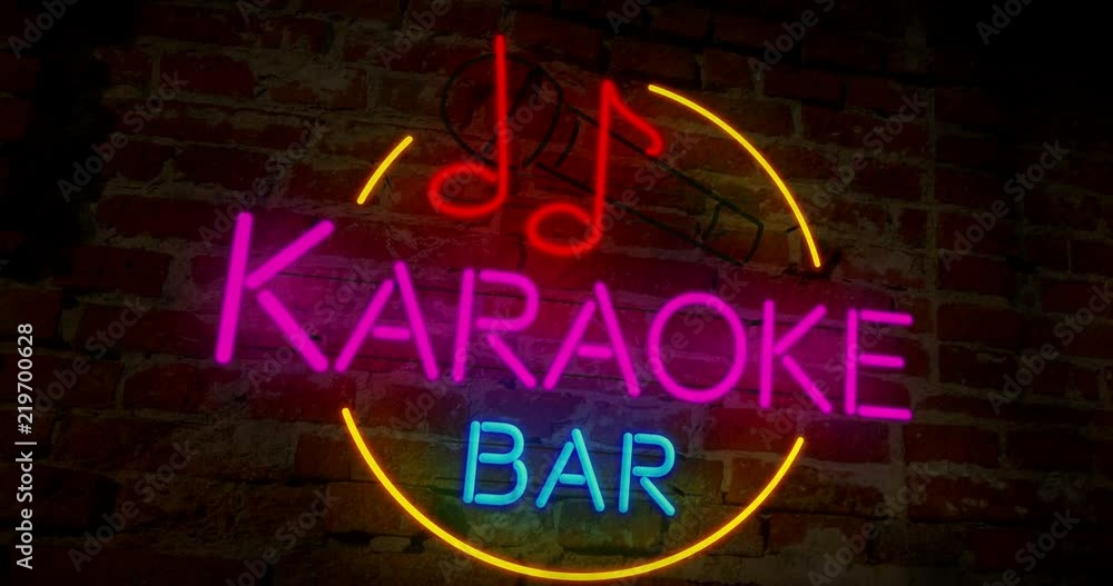 Karaoke bar neon retro animation. Abstract 3D flight over electric lettering on brick wall background. Karaoke bar neon retro animation. Abstract 3D flight over electric lettering on brick wall background.