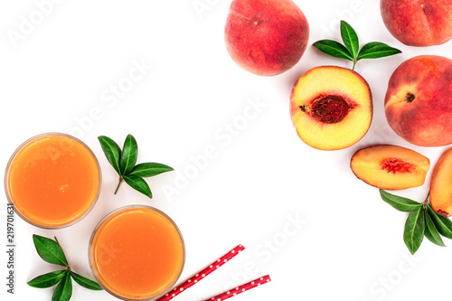 Fototapeta Naklejka Na Ścianę i Meble -  peach juice with leaves isolated on white background with copy space for your text. Top view. Flat lay pattern