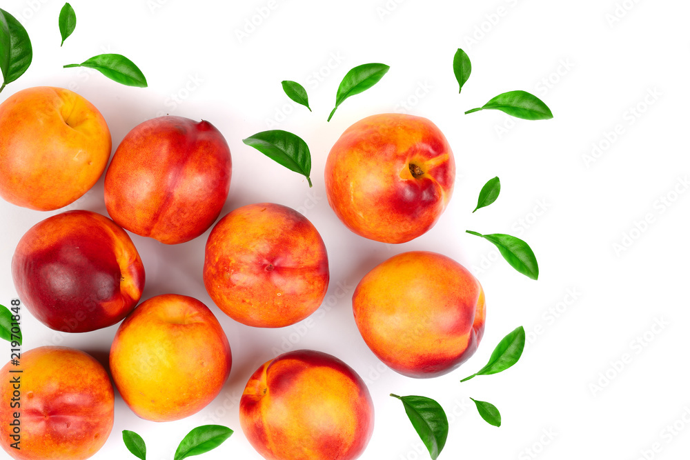 ripe nectarine with leaves isolated on white background with copy space for your text. Top view. Flat lay pattern ripe nectarine with leaves isolated on white background with copy space for your text. Top view. Flat lay pattern