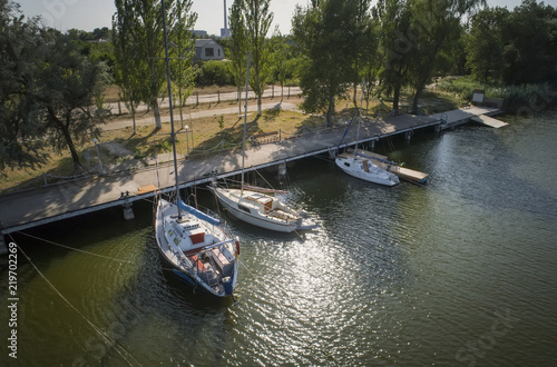 Pier with boats, marina lot. Aerial top view from drone.