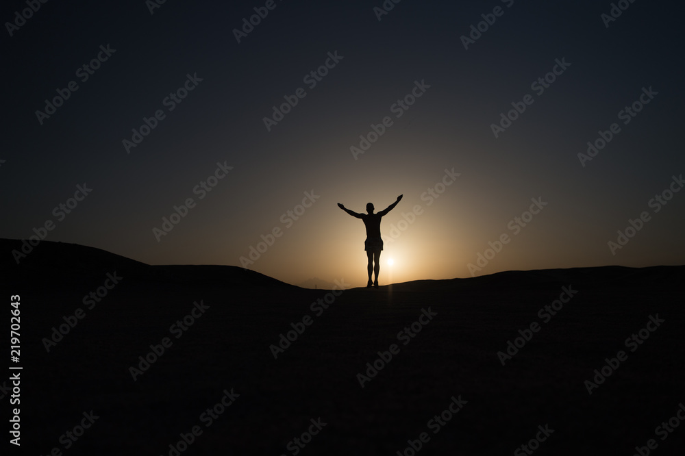 Achieve main goal. Silhouette man stand proud in front of sunset sky background. Future success depends on your efforts now. Daily motivation. Healthy lifestyle personal achievement goal and success