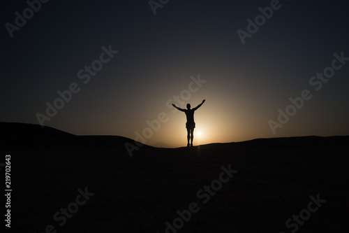 Achieve main goal. Silhouette man stand proud in front of sunset sky background. Future success depends on your efforts now. Daily motivation. Healthy lifestyle personal achievement goal and success