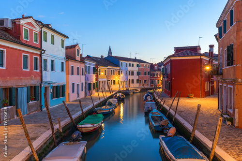 Street view with colorful buildings in Burano island, Venice, Italy. Architecture and landmarks of Burano, Venice postcard. Scenic canal and colorful architecture in Burano island near Venice, Italy