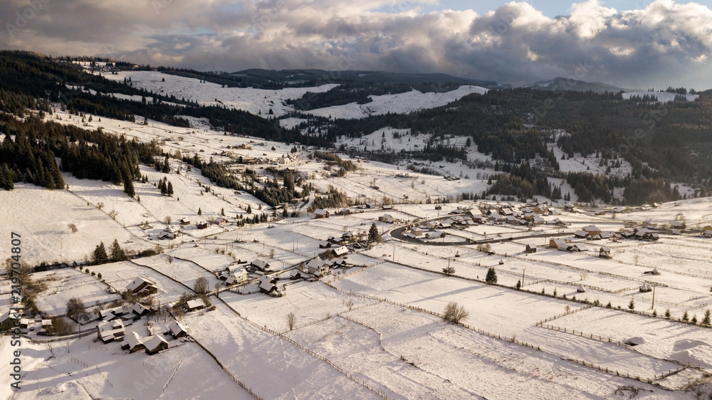 Aerial view of a village in Romania during a cold winter day