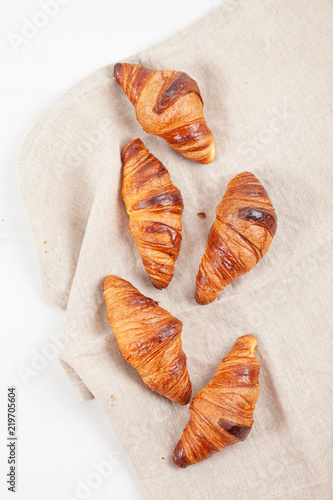 Top view over freshly baked croissants for breakfast
