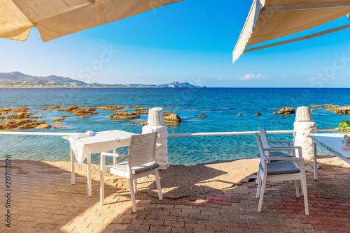 Table and chairs in coastal restaurant on Kolymbia beach. Rhodes island  Greece