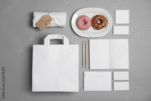 Flat lay composition with items for mock up design on gray background. Food delivery service photo