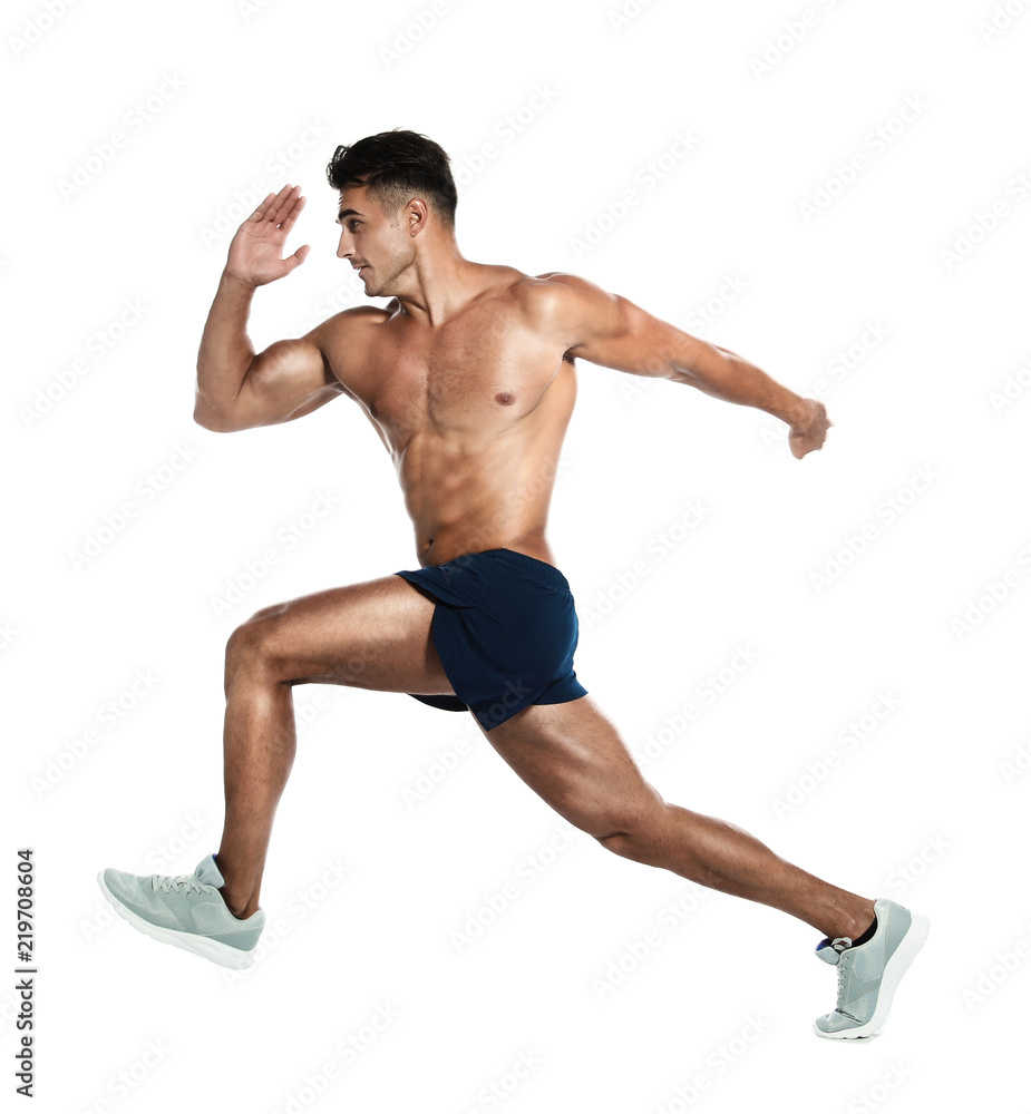 Handsome young man running on white background