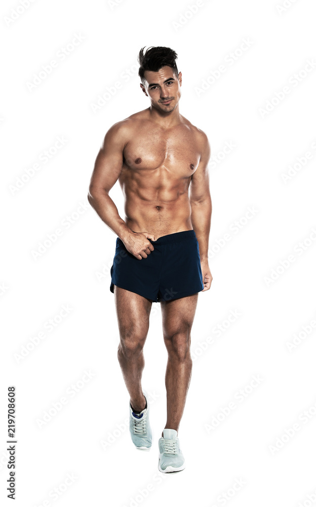 Handsome young man running on white background Handsome young man running on white background