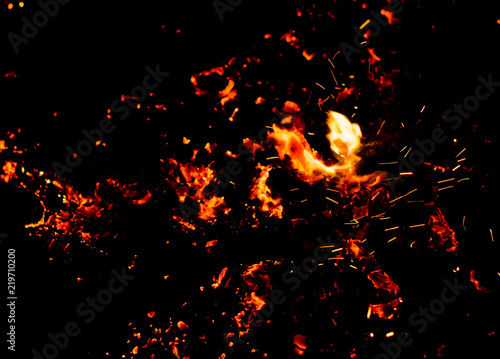 Flame of fire with sparks on a black background