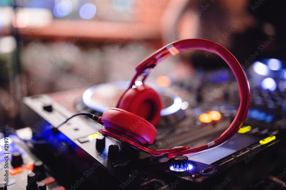 Red headphones for professional disc  play music,listen new tracks  in high  with powerful bass audio equipment for sound  recording studio. Music concept with blurred background Stock Photo | Adobe  Stock