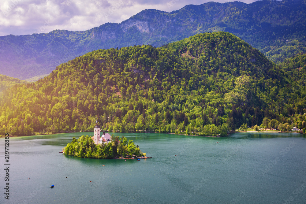 Fototapeta premium Lake Bled with St. Marys Church of Assumption on small island. Bled, Slovenia, Europe. The Church of the Assumption, Bled, Slovenia. The Lake Bled and Santa Maria Church near Bled, Slovenia.