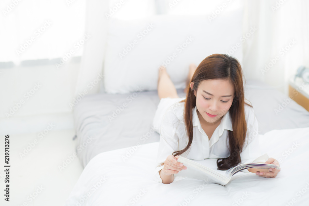 Beautiful portrait young asian woman relax lying reading book on bedroom in morning at home, girl study literature, education and lifestyle concept. Beautiful portrait young asian woman relax lying reading book on bedroom in morning at home, girl study literature, education and lifestyle concept.