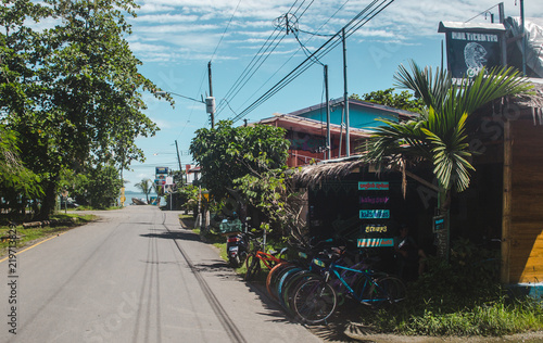 Street lined with bicycle hire shops and cafes in the popular tourism destination of Puerto Viejo, on the Caribbean side of Costa Rica