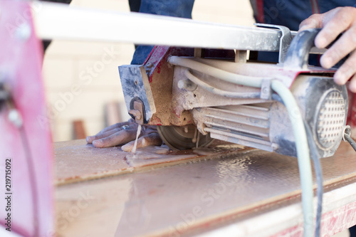 Cutting porcelain tiles using a diamond blade saw