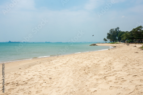 Beach at east Coast Park in Singapore with ships in the background