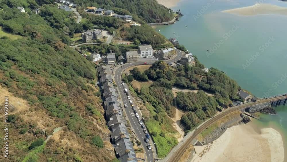 Aerial view, tilt up and zoom in move. Drone panorama over sea, tree, hills and houses, Barmouth, Wales Aerial view, tilt up and zoom in move. Drone panorama over sea, tree, hills and houses, Barmouth, Wales