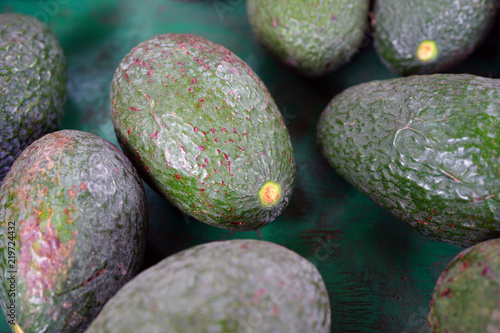 Green avocados at a road stand in Hawaii