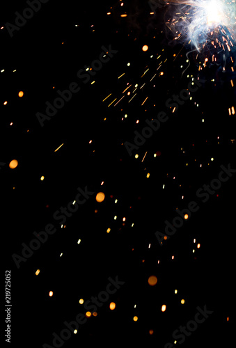 Flash and sparks from electric welding