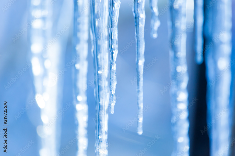 icicles hanging from the roof or pipes in winter icicles hanging from the roof or pipes in winter