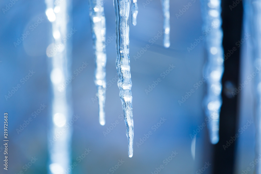icicles hanging from the roof or pipes in winter icicles hanging from the roof or pipes in winter