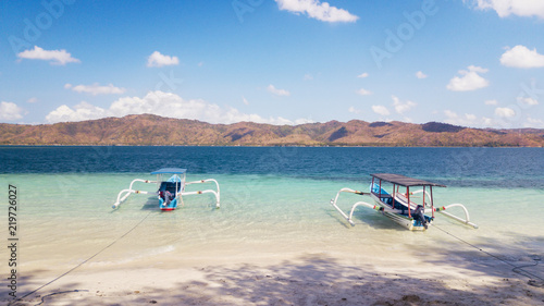 Two tourist boats anchoring on the beach