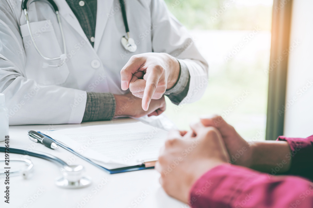 Doctors and patients sit and talk. At the table near the window in the hospital. Doctors and patients sit and talk. At the table near the window in the hospital.