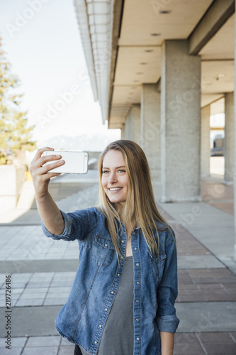 Woman in her twenties taking a selfie or videocalling photo