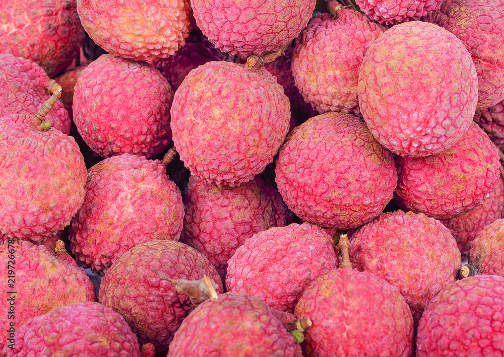 Fresh red lychee fruits background Fresh red lychee fruits background