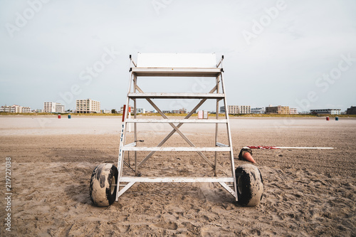 Empty Lifeguard Stand At Wildwood New Jersey Shore Beach with Hotels for Vacation in Background
