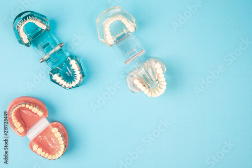 dentist tools and orthodontic on the blue background, flat lay, top view.