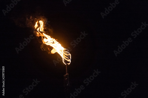 Burning Torch in the Night at black background