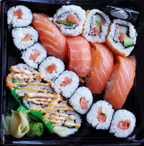 close up on fresh sushi on black tray