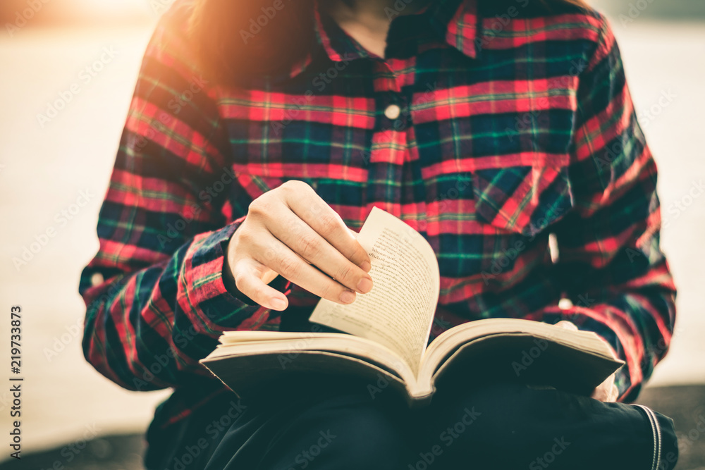 Fototapeta premium Women read books in quiet nature, concept read a books.