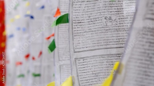 Buddhist prayer flags moves on the wind, close up view