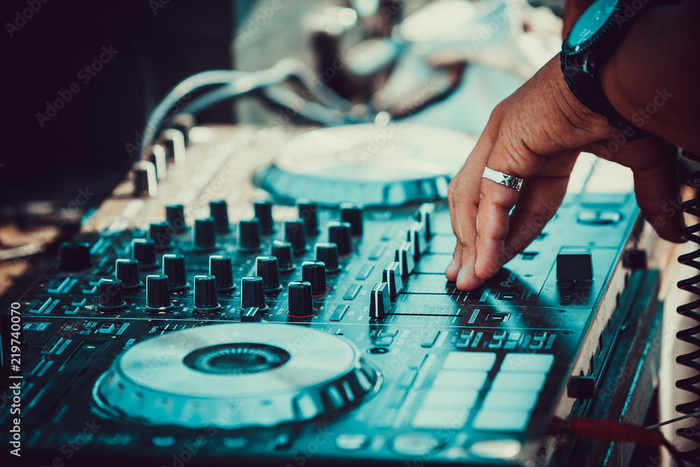 DJ plays and mix music on digital midi mixer controller DJ plays and mix music on digital midi mixer controller