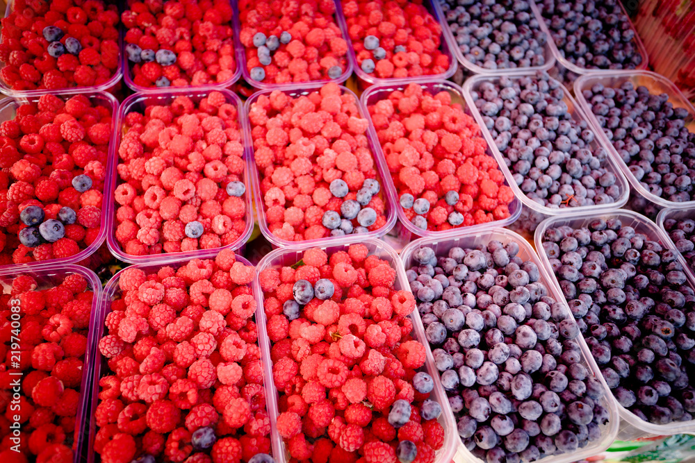 Berry fruits in baskets at a marketplace. mixed berries at eco market Berry fruits in baskets at a marketplace. mixed berries at eco market