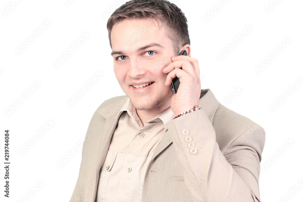 Young smiling businessman calling in the phone isolated on white Young smiling businessman calling in the phone isolated on white
