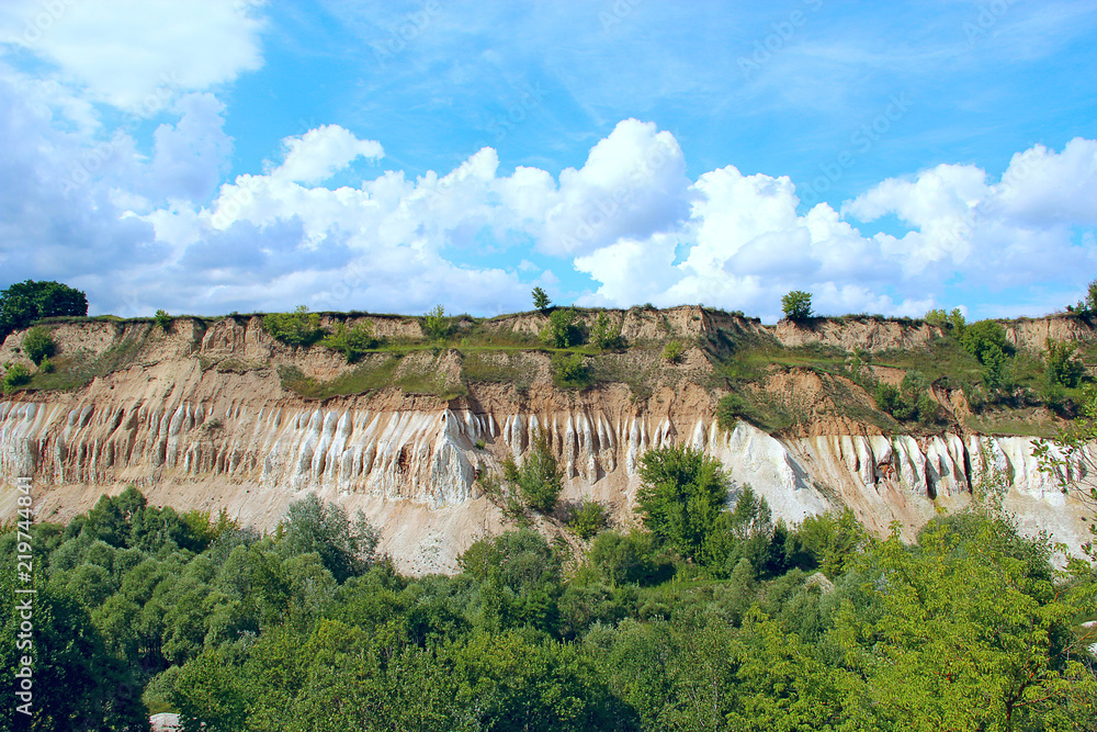 Cretaceous quarry. Landscape with sandy cliffs and beautiful sky