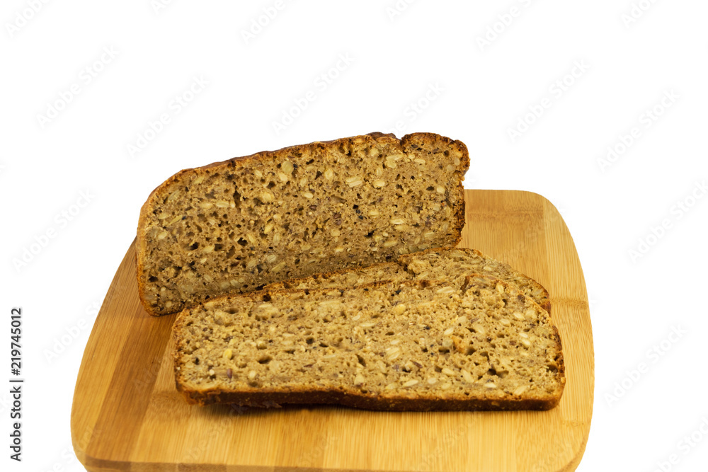 Sliced rye bread on cutting board. Whole grain rye bread with seeds. Delicious whole grain bread. Sliced rye bread on cutting board. Whole grain rye bread with seeds. Delicious whole grain bread.