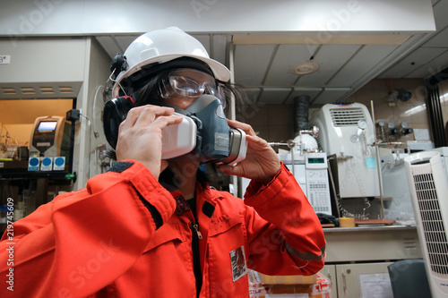 Multi-purpose respirator half mask for toxic gas protection.The man prepare to wear Multi-purpose half mask.