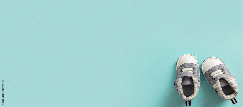 Baby boy shoes on pastel blue background, banner Stock Photo | Adobe Stock