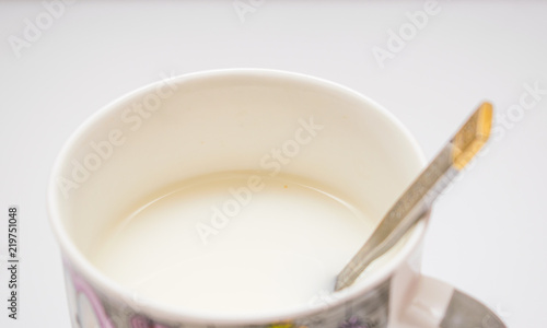 A cup of tea with milk.