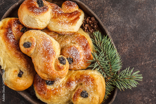 Traditional Swedish Christmas saffron buns (lussebulle or lussekatt). Swedish christmas. photo