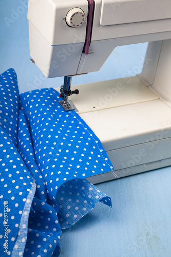 Sewing machine and blue fabric