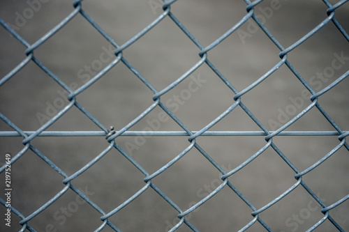grey iron fence, abstract close up view with concrete background