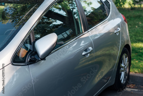 detail of parked shiny grey car, transport background © LIGHTFIELD STUDIOS