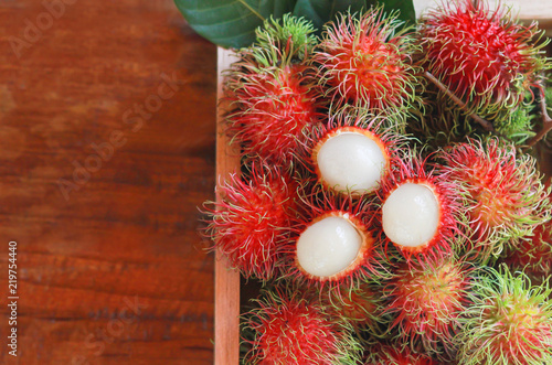 Top view of fresh rambutan in the wooden box  asian fruit  asian fruit.