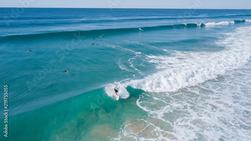 Wallpaper Mural Surfers on beautiful day enyouing the waves in Australia, photographed from above using a drone. Torontodigital.ca